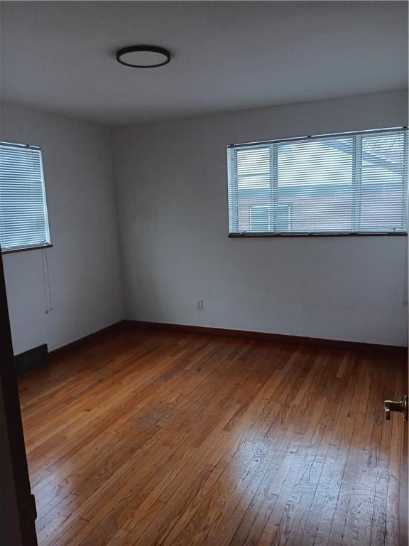 empty room featuring hardwood / wood-style flooring