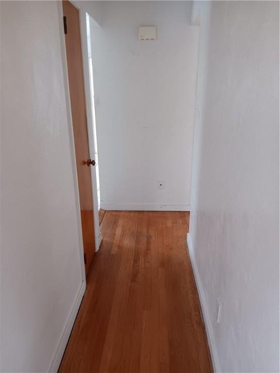 hall with light hardwood / wood-style flooring