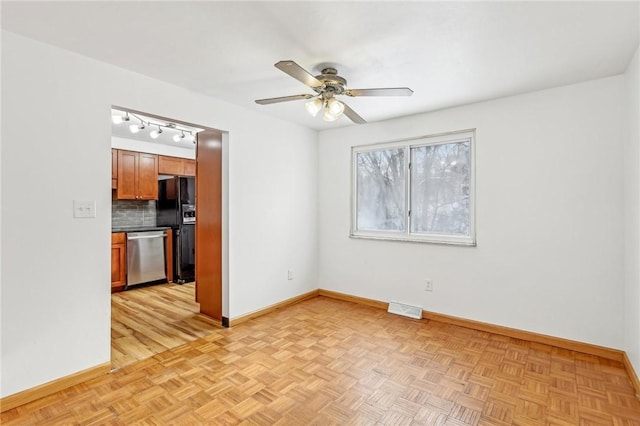 spare room with ceiling fan