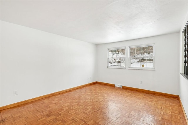 empty room with light parquet flooring