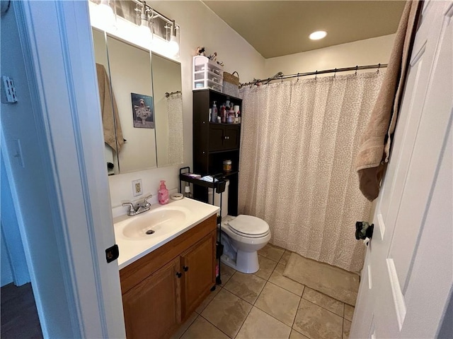 bathroom with tile patterned floors, vanity, and toilet