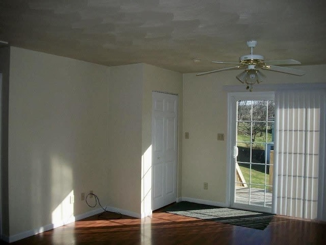 interior space with ceiling fan