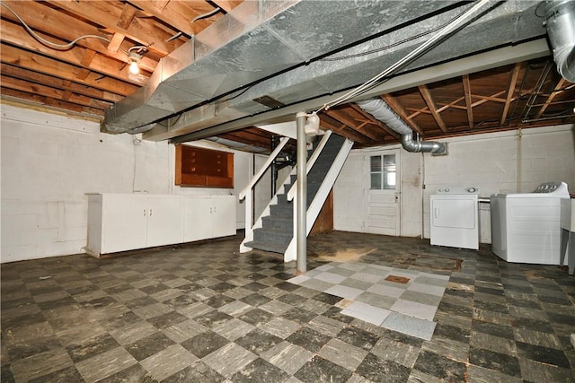 basement featuring washer and clothes dryer