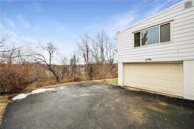 view of home's exterior with a garage