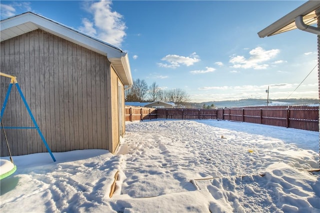 view of yard layered in snow