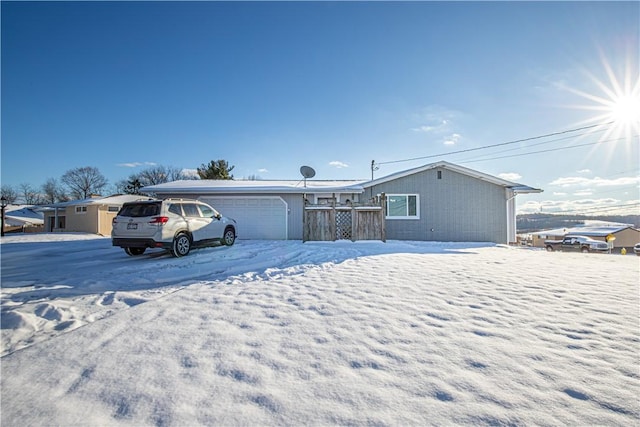 single story home featuring a garage