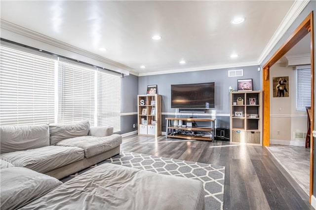 living room featuring hardwood / wood-style floors and ornamental molding