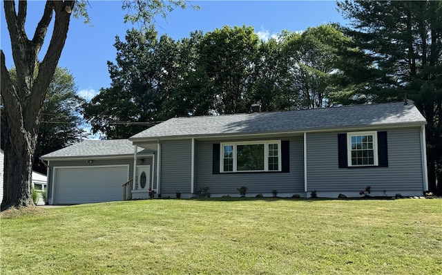 single story home with a front yard and a garage