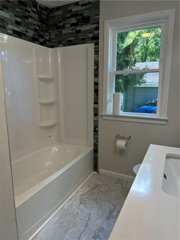 bathroom featuring sink and shower / bathtub combination