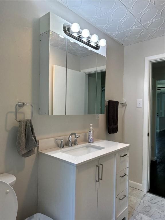 bathroom with vanity and toilet