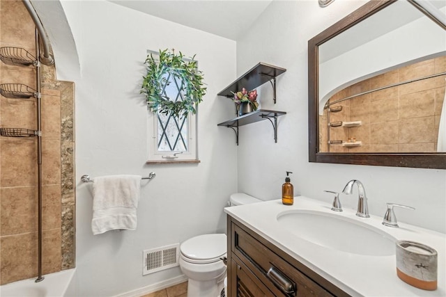 full bathroom featuring vanity, bathtub / shower combination, and toilet