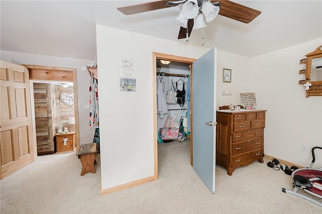 bedroom featuring light colored carpet and ceiling fan