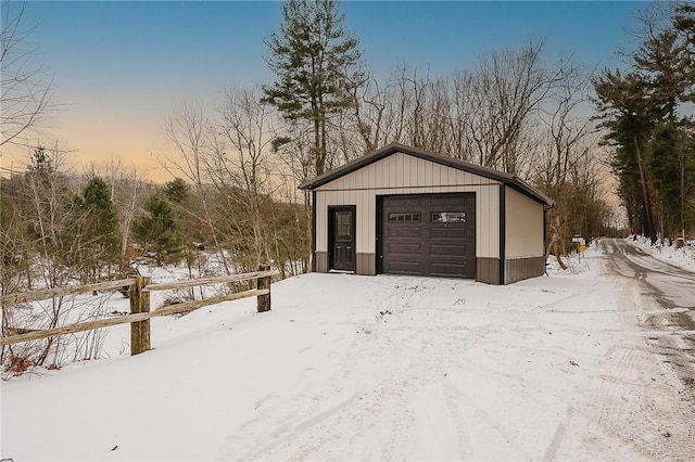 view of snow covered garage