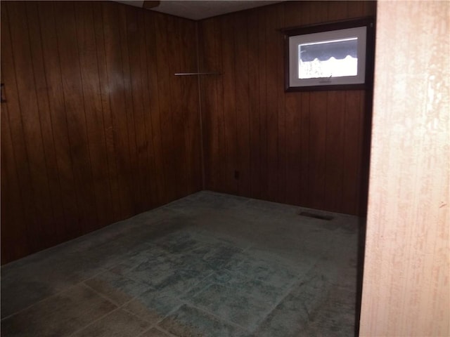 empty room with wooden walls