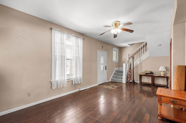 entrance foyer featuring a baseboard radiator, baseboards, stairs, and hardwood / wood-style flooring