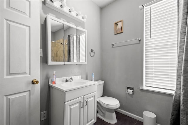 bathroom with curtained shower, baseboards, toilet, tile patterned floors, and vanity