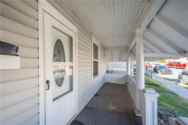 entrance to property featuring covered porch