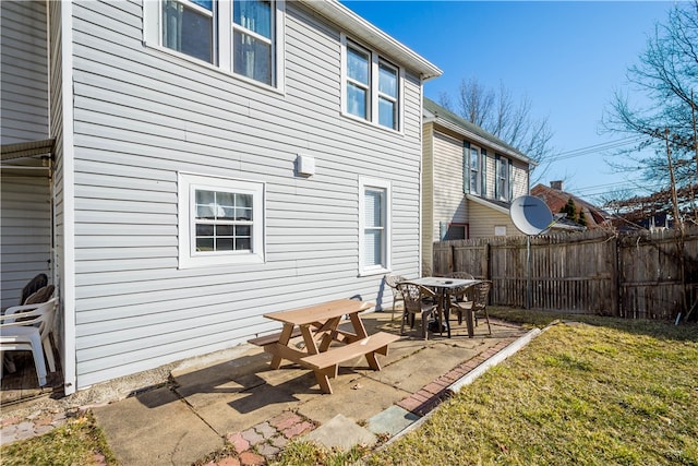 back of house with a yard, a patio area, and fence