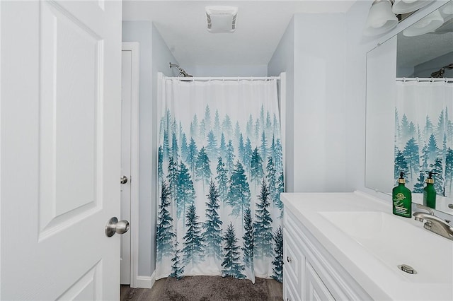 bathroom featuring vanity and walk in shower