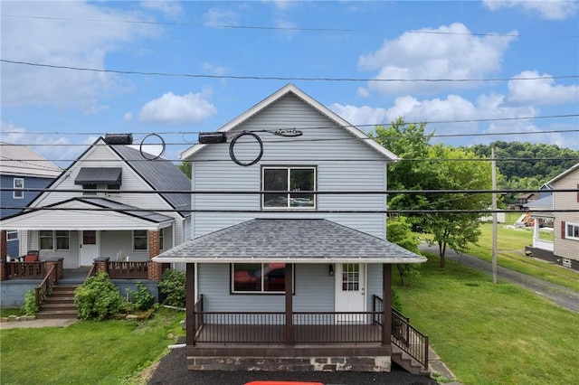 view of front of property featuring a porch and a front lawn