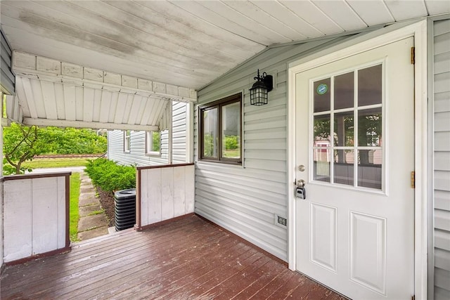 wooden terrace featuring a porch and central air condition unit