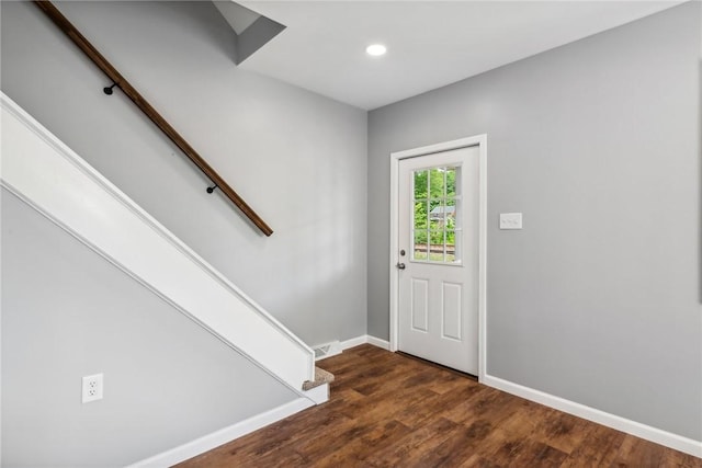 entryway with dark hardwood / wood-style floors