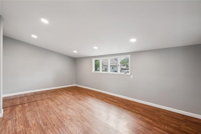 spare room with hardwood / wood-style flooring