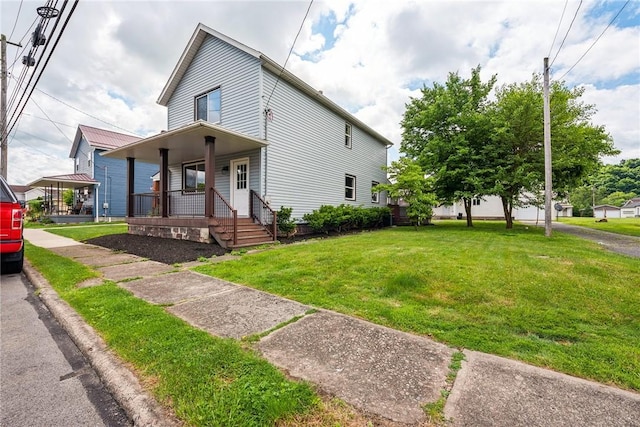 view of front of property with covered porch and a front yard