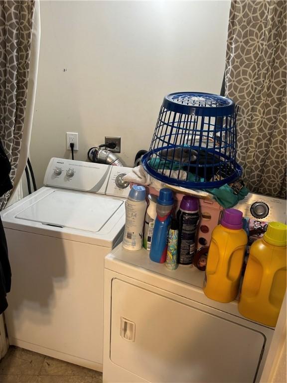 laundry area with separate washer and dryer