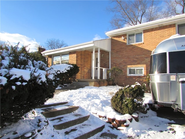 view of snow covered property