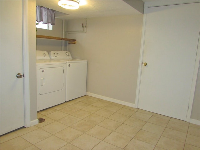 washroom featuring separate washer and dryer and light tile patterned floors