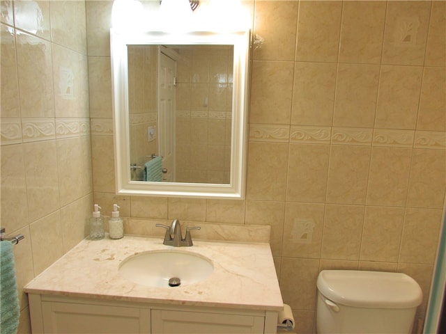 bathroom with radiator heating unit, tile walls, toilet, and vanity