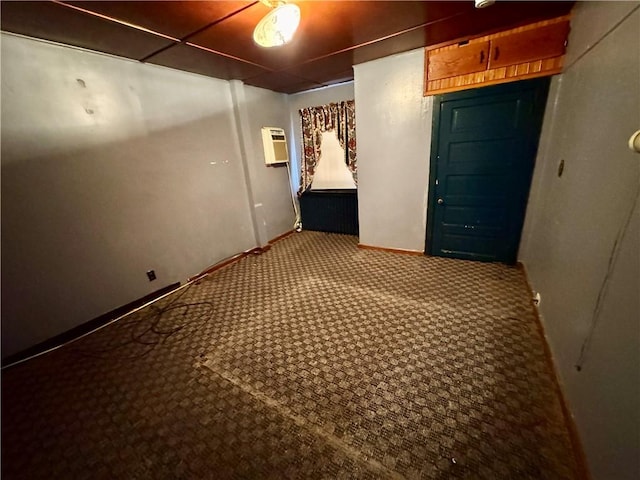 carpeted spare room with a wall mounted AC