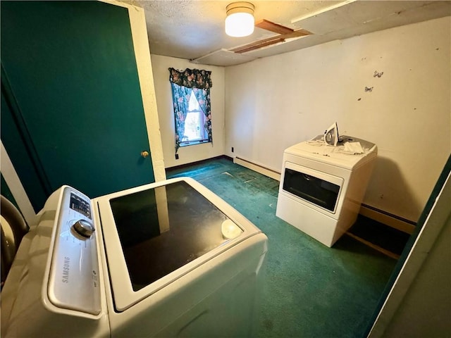 laundry room featuring dark carpet, separate washer and dryer, and baseboard heating