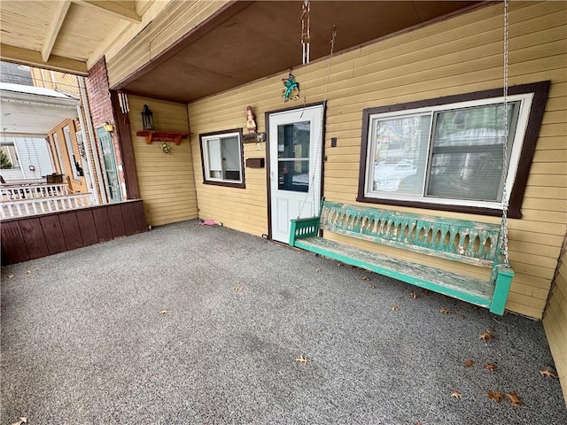 entrance to property with covered porch