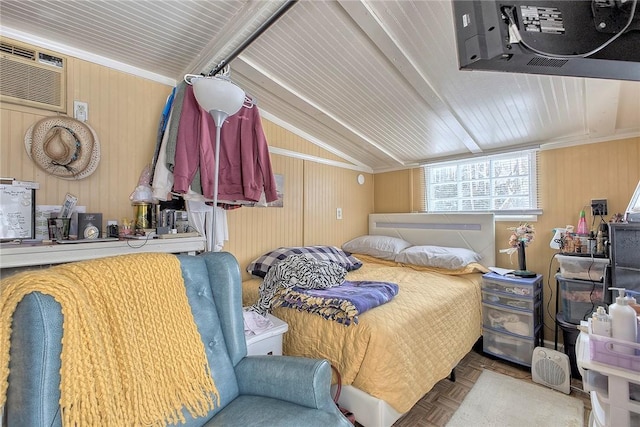 bedroom featuring an AC wall unit, wood walls, and light parquet flooring