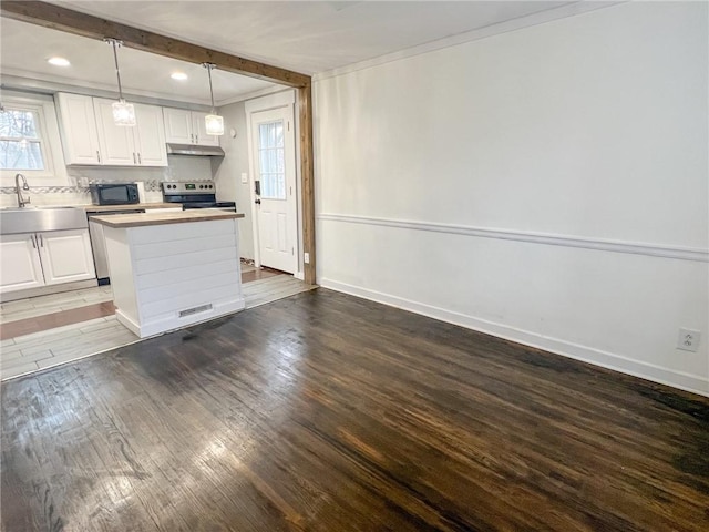 kitchen with sink, white cabinets, hanging light fixtures, and stainless steel electric range