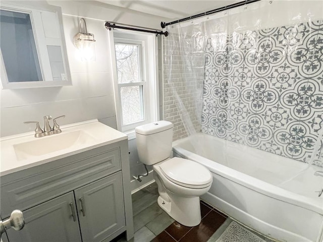 full bathroom with shower / bath combo, toilet, and vanity