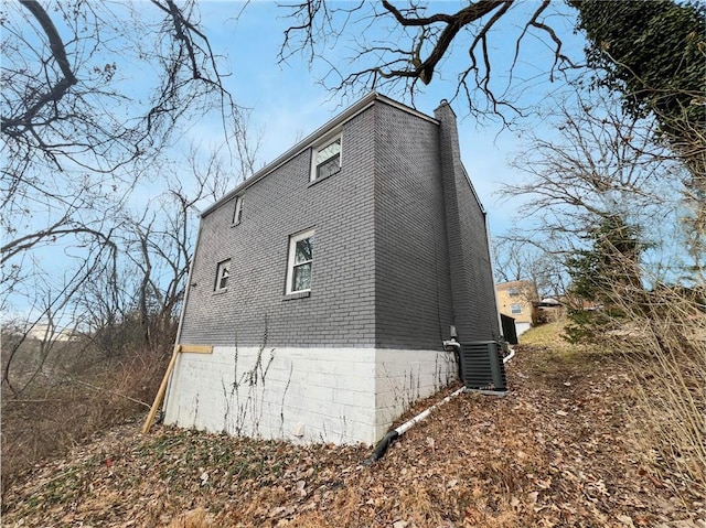 view of property exterior featuring central AC