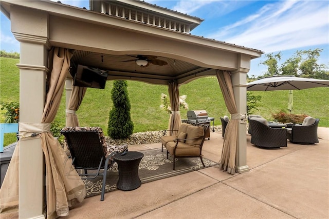 view of patio / terrace featuring a gazebo, ceiling fan, and a grill