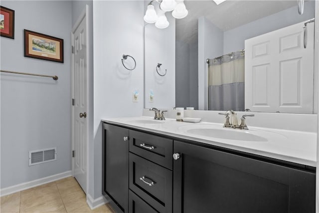 bathroom featuring tile patterned floors, a shower with curtain, and vanity