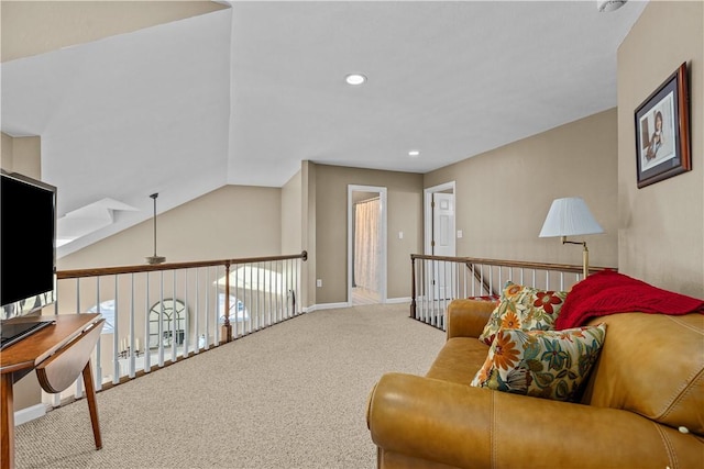 sitting room featuring carpet and vaulted ceiling