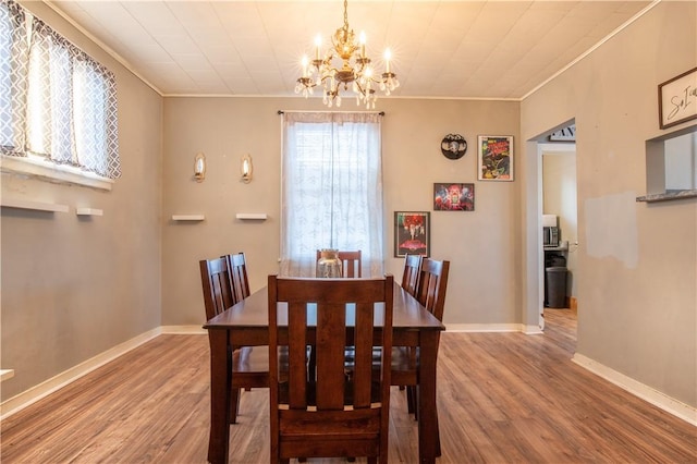 4 Hookton Ave, South Union Twp, PA 15401 - dining space with ornamental molding, a chandelier, wood finished floors, and baseboards