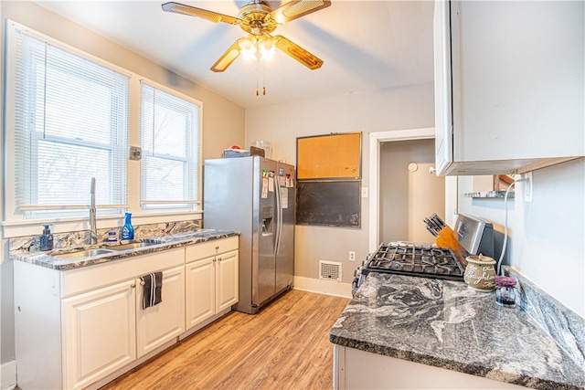 4 Hookton Ave, South Union Twp, PA 15401 - kitchen featuring stainless steel refrigerator with ice dispenser, a sink, gas range oven, light wood finished floors, and a ceiling fan