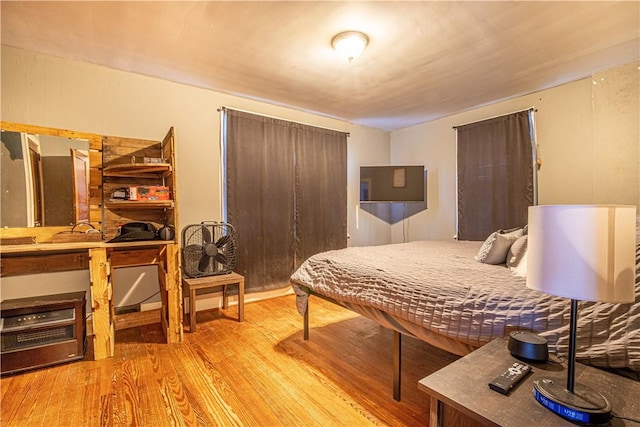 bedroom with light hardwood / wood-style floors