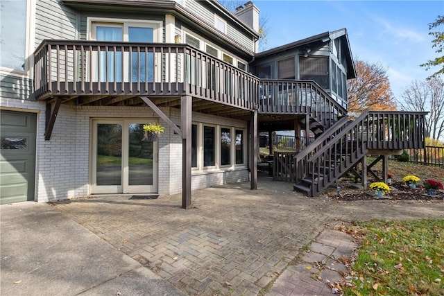 rear view of house with a wooden deck