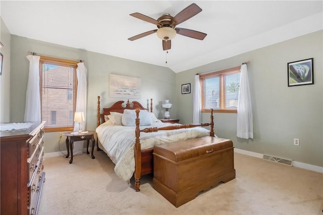 bedroom with light carpet and ceiling fan