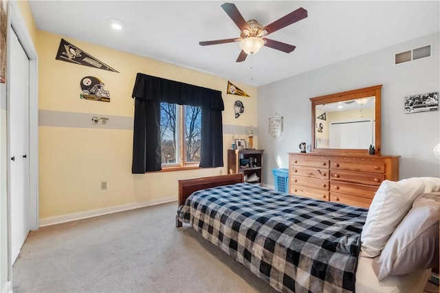 bedroom with ceiling fan, a closet, and carpet floors