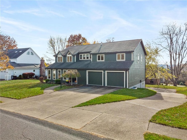 view of front facade featuring a front yard and a garage