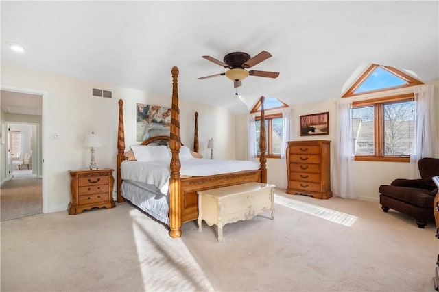 carpeted bedroom featuring ceiling fan and vaulted ceiling